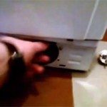 Unscrew the washing machine filter