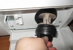 The washing machine hums when draining