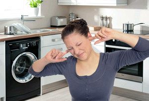 Why does my washing machine hum or whistle when washing?