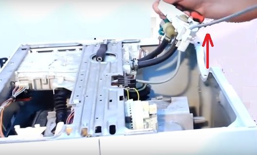 remove the plastic fastening for the valve and pipes