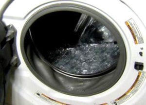 The washing machine fills with water when turned off.