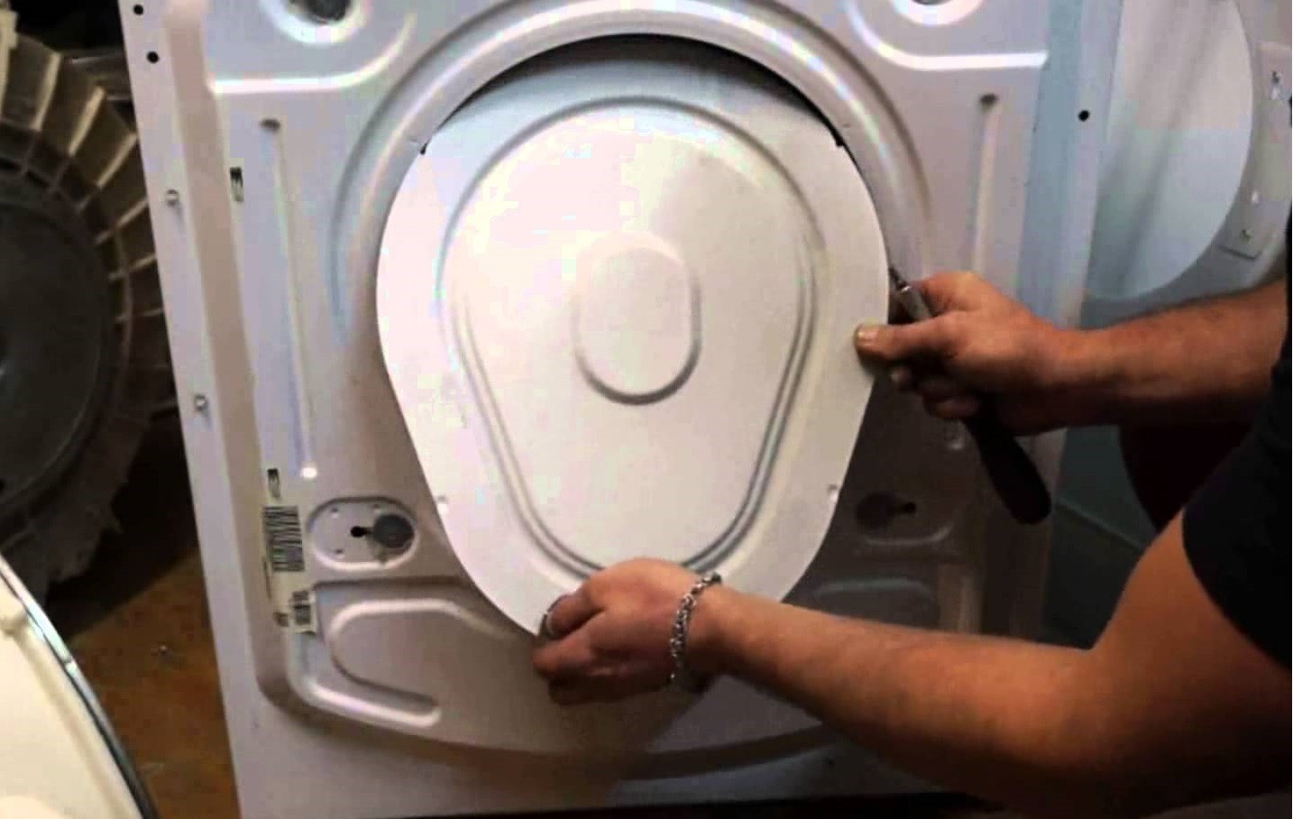 Removing the back panel of the Candy washing machine