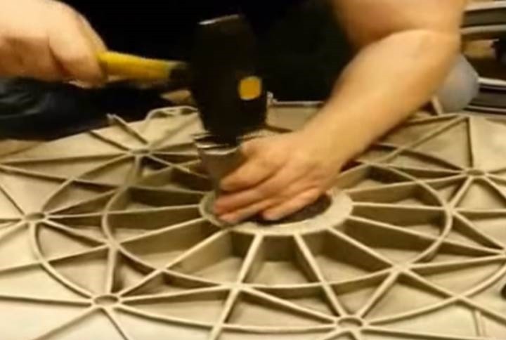 We install the bearing using a flat punch and a hammer