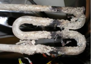 What can happen to a washing machine's heating element if you don't soften the water?