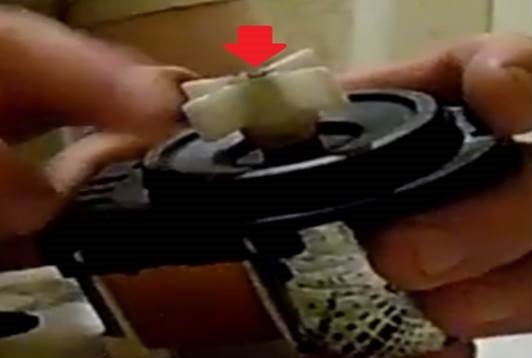 We'll cut off the plastic tip of the impeller with a hacksaw