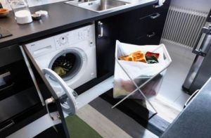 hide the machine behind the cabinet door