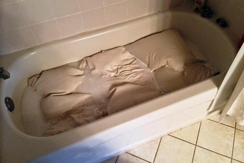 Before hand washing, soak the blanket in the bath