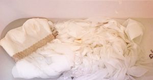 the dress can be completely or partially soaked in a soap solution