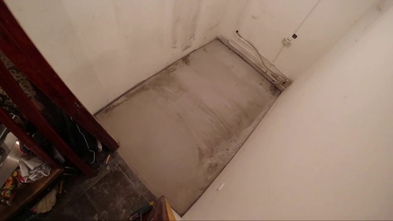 We're laying the floor and plumbing in the storage room.