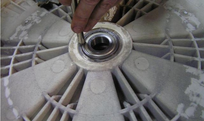 The process of replacing bearings on an LG washing machine