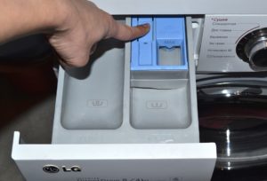 How to remove the detergent drawer from the LG washing machine?