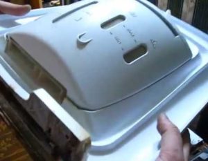 How to remove the lid from an Indesit top-loading washing machine