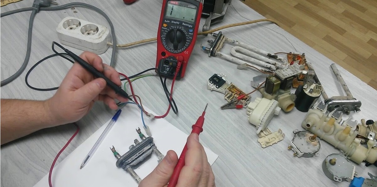 Let's check the heating element of the Indesit washing machine.