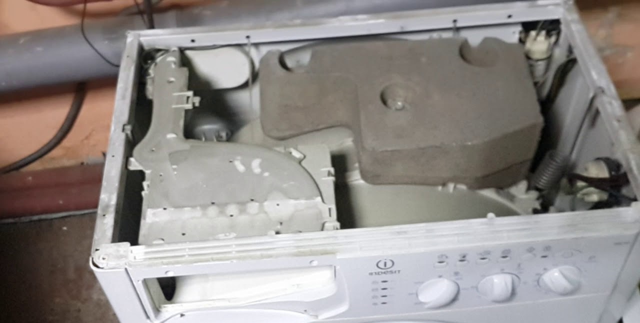 We install the dispenser, upper counterweight, and pressure switch.