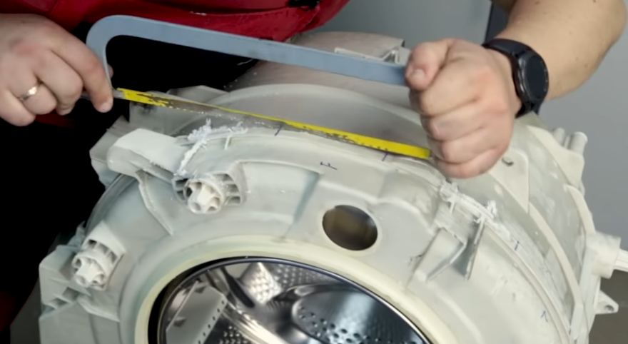 We're sawing the tank of a Beko washing machine.