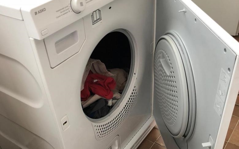 load the clothes into the dryer