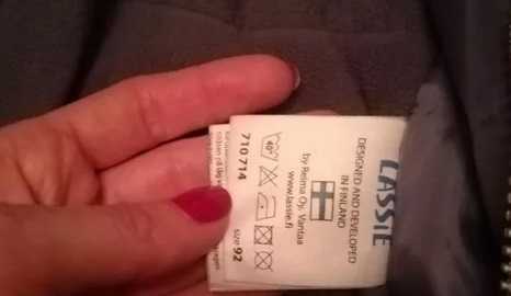 examine the tag on the jumpsuit