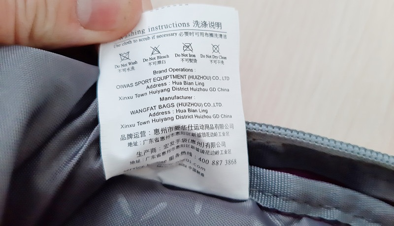 examine the tag on the backpack