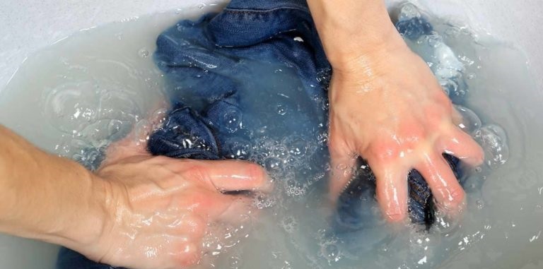 hand washing a denim jacket