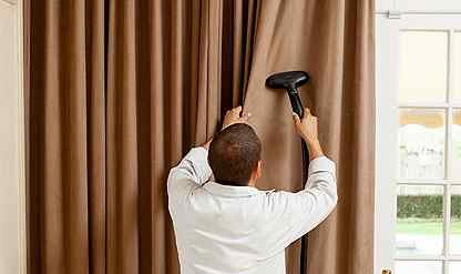 We clean curtains without removing them from the curtain rod.