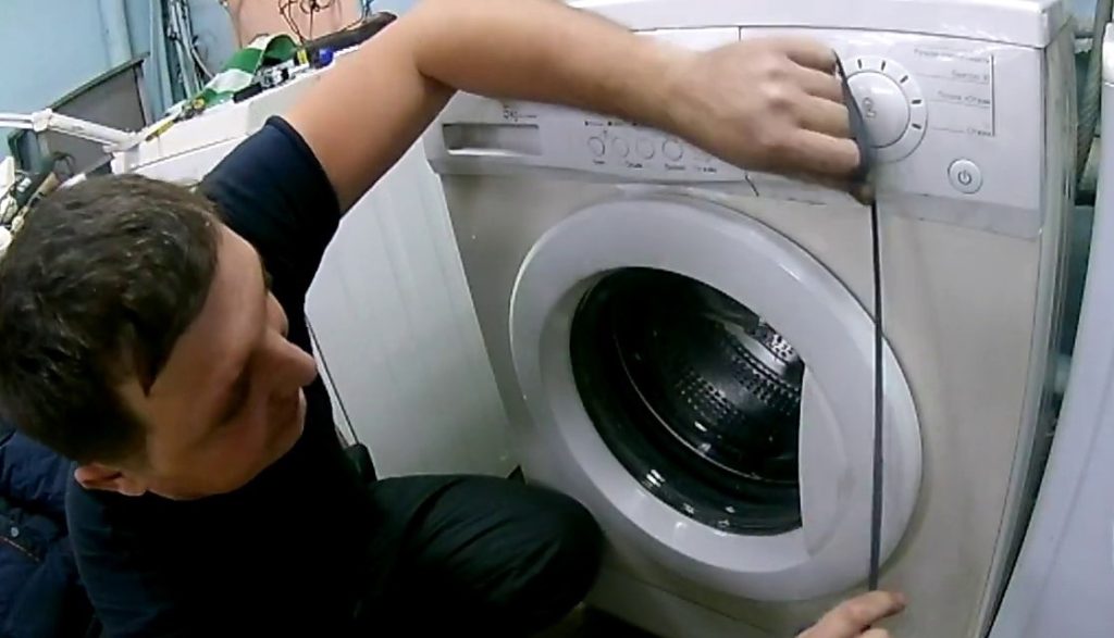 How to open a washing machine door with a cord