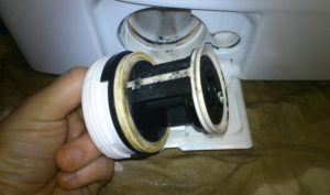 Start by cleaning the filter of your Candy washing machine.