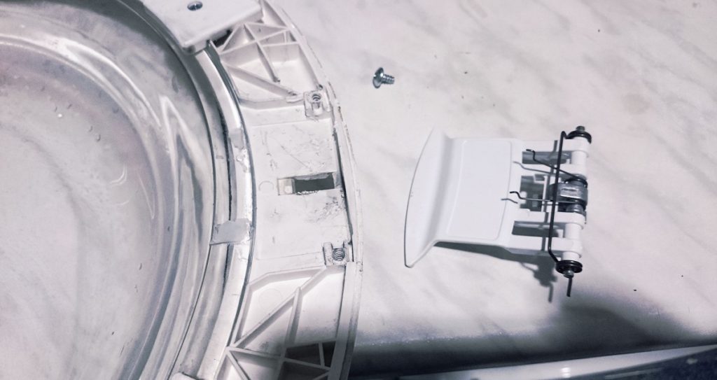 disassembling the hatch and replacing the handle