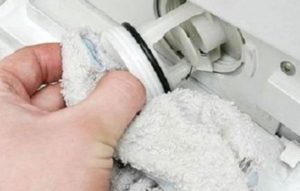 removing water through a waste filter