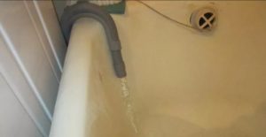 gravity drainage of water through a hose