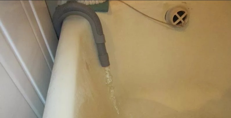 gravity drainage of water through a hose