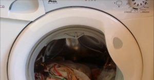 Candy's washing machine is stuck with water and laundry