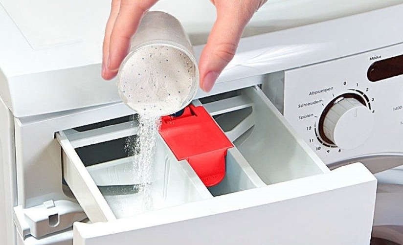 pour powder into the Miele machine tray