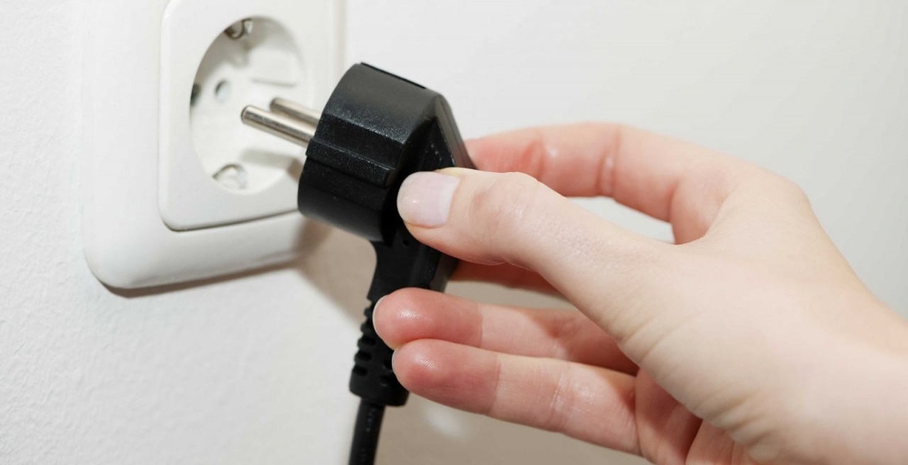 temporarily disconnect the machine from the power supply