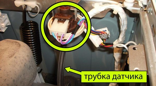 We find the pressure switch under the top cover