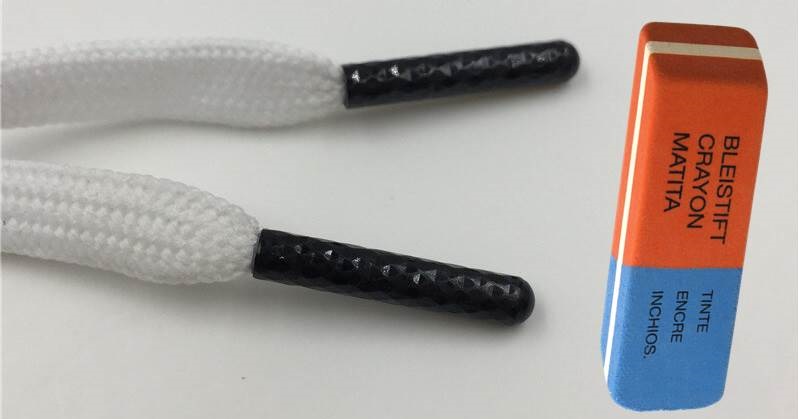 The plastic ends of the laces are cleaned with an eraser