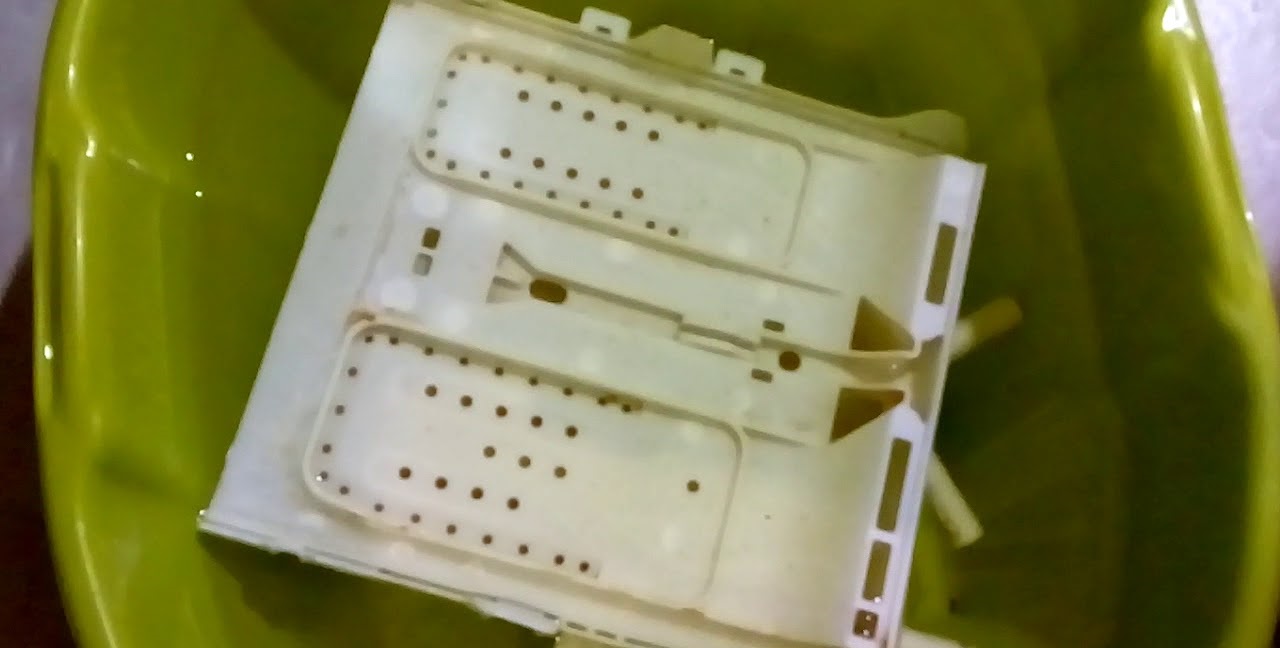 cleaning the dispenser in a solution of citric acid