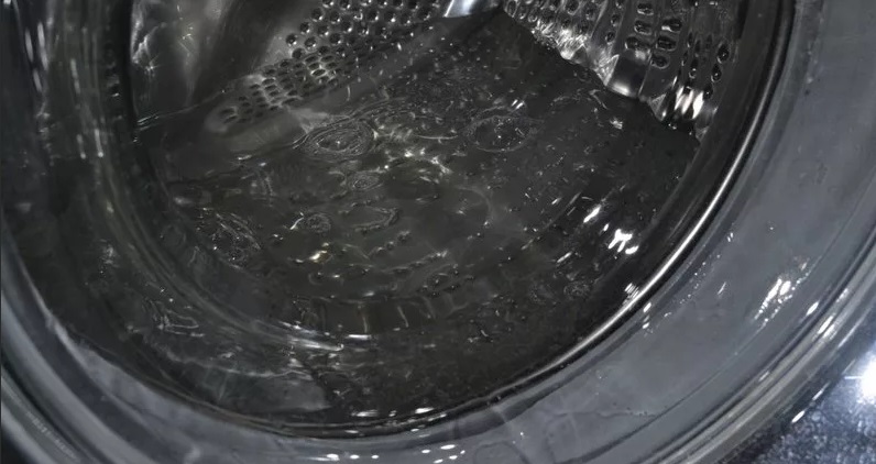 There is water in the drum of the washing machine.