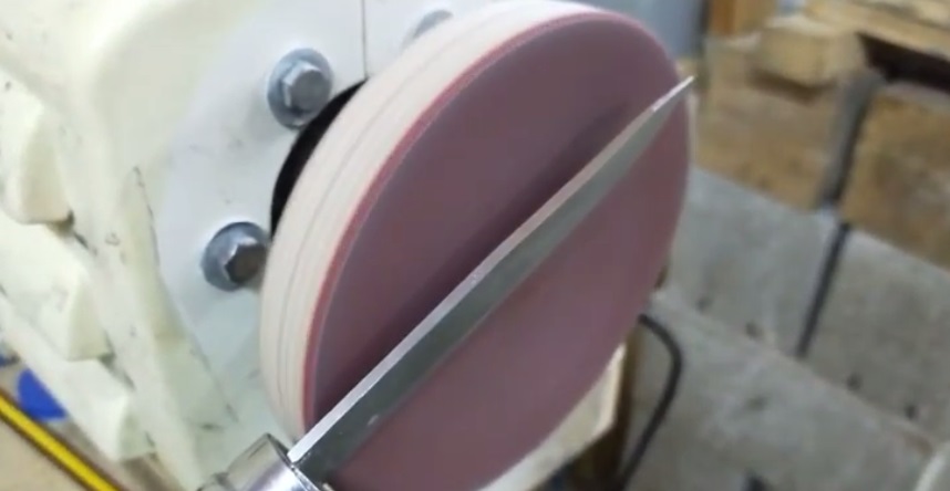 We glue the abrasive disc and test it.
