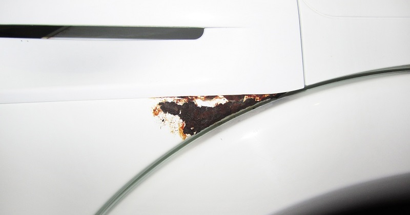 sand down rusty areas