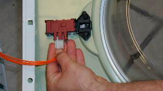 unscrew and remove the door lock