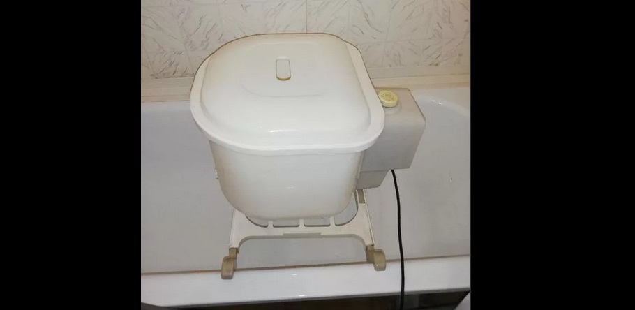 semi-automatic washing machine in the bathtub