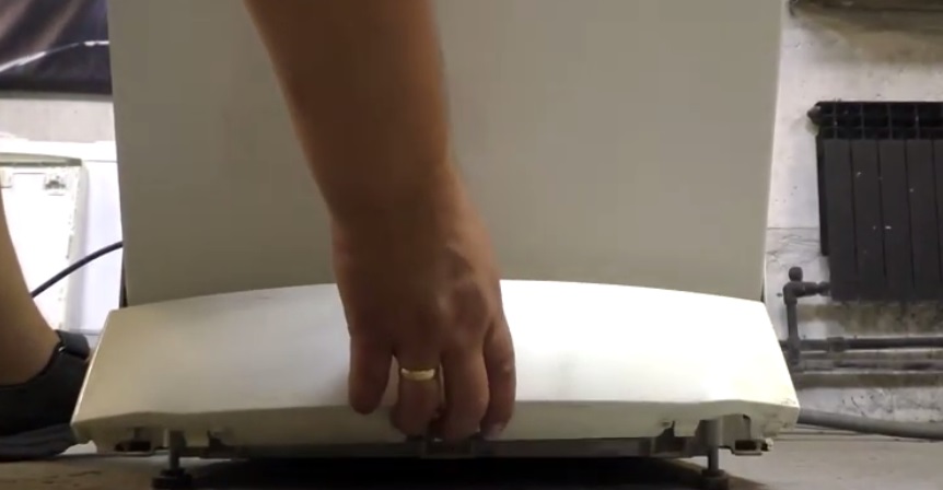 Remove the bottom panel of the Electrolux dishwasher.