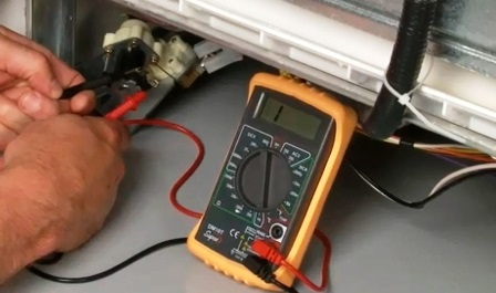 Checking the dishwasher's heating element with a multimeter