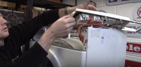 Place the control panel on the washing machine
