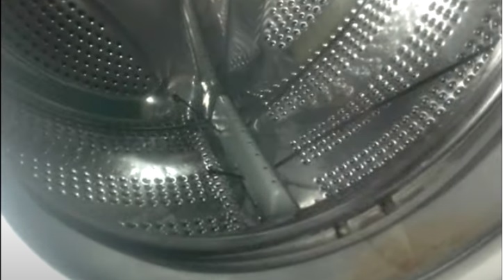 we pass the clamps through the holes in the drum