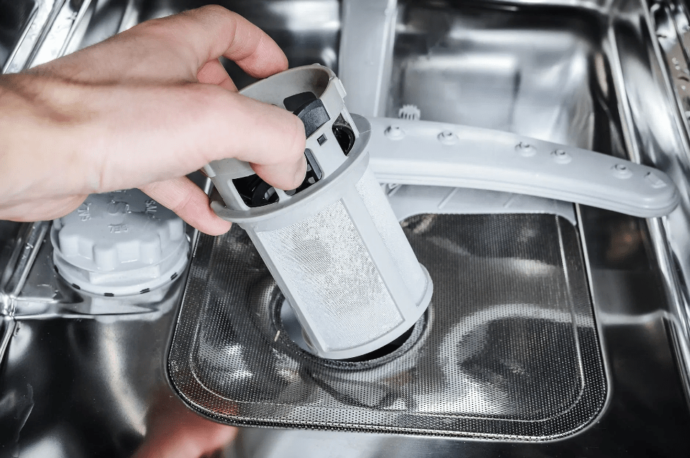 Should there be water left in the dishwasher filter compartment?