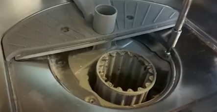 Unscrew the screws near the dishwasher filter