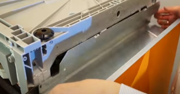 remove the lower false panel of the dishwasher