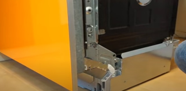 remove the decorative cover of the dishwasher door opening mechanism
