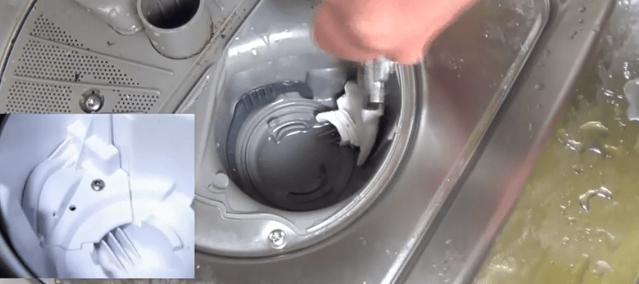 Unscrew the screws near the dishwasher filter